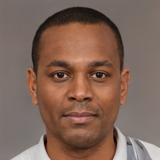 Neutral latino young-adult male with short  brown hair and brown eyes