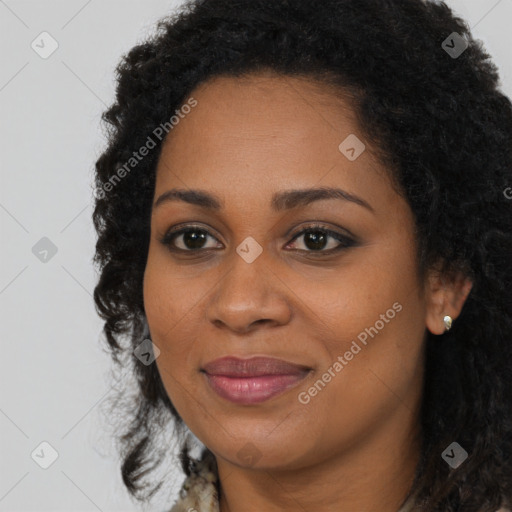 Joyful black young-adult female with long  brown hair and brown eyes