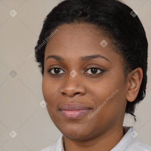 Joyful black young-adult female with short  brown hair and brown eyes