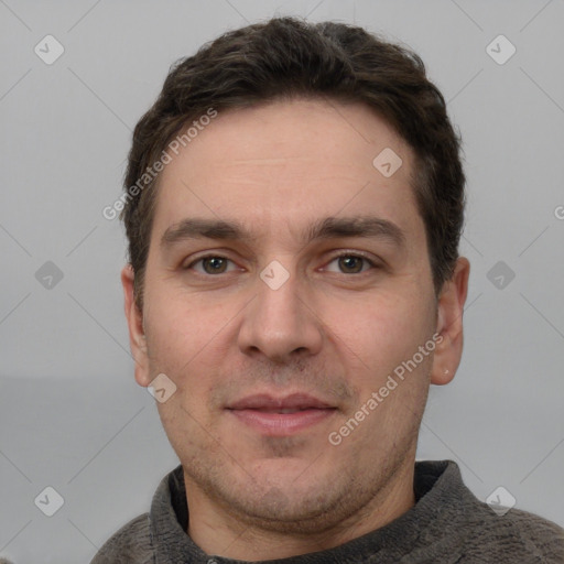 Joyful white adult male with short  brown hair and grey eyes