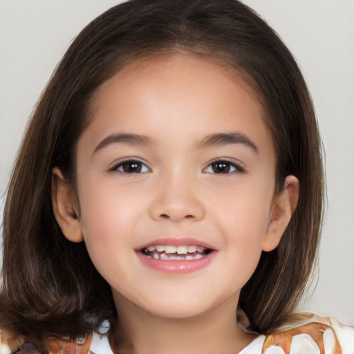 Joyful white child female with medium  brown hair and brown eyes