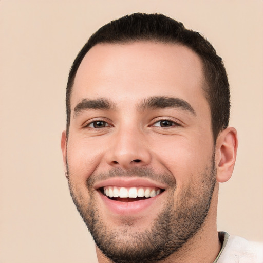 Joyful white young-adult male with short  black hair and brown eyes