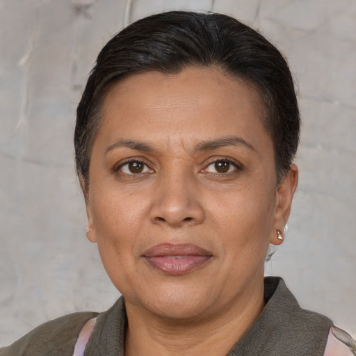 Joyful white adult female with short  brown hair and brown eyes