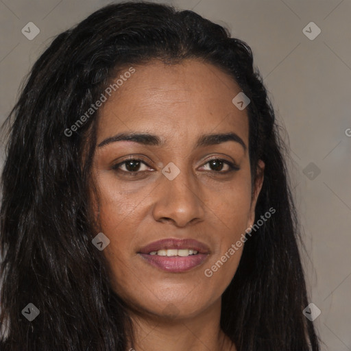 Joyful black young-adult female with long  brown hair and brown eyes