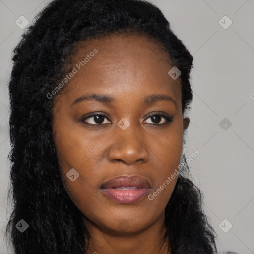 Joyful black young-adult female with long  black hair and brown eyes