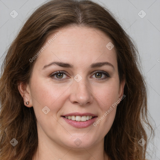 Joyful white adult female with long  brown hair and green eyes