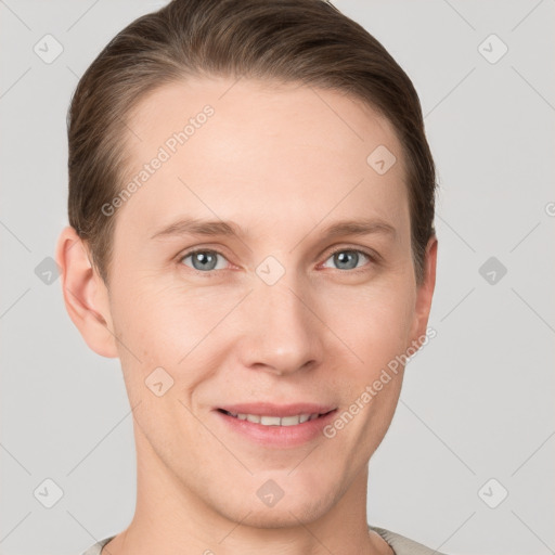 Joyful white young-adult male with short  brown hair and grey eyes