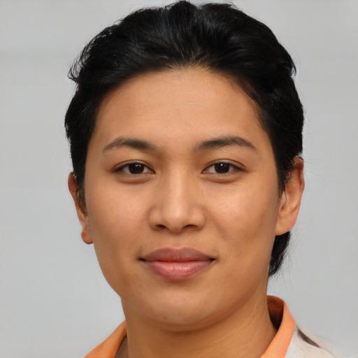 Joyful asian young-adult female with short  black hair and brown eyes