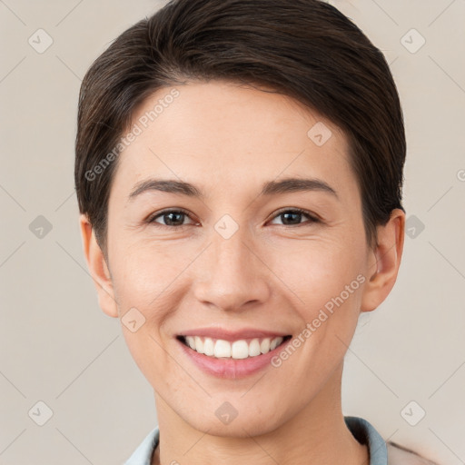 Joyful white young-adult female with short  brown hair and brown eyes