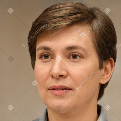 Joyful white adult female with short  brown hair and brown eyes