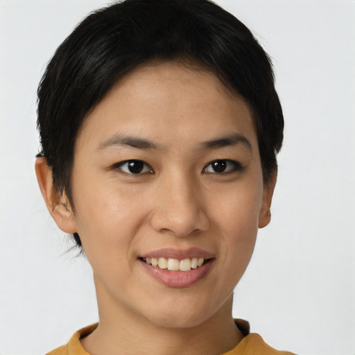 Joyful asian young-adult female with short  brown hair and brown eyes