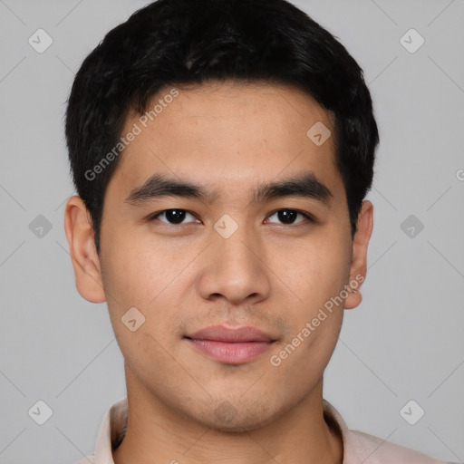 Joyful asian young-adult male with short  black hair and brown eyes