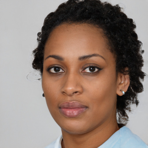 Neutral black young-adult female with medium  black hair and brown eyes