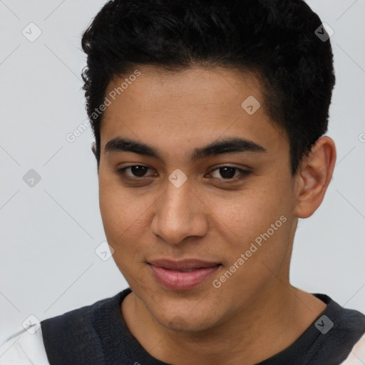 Joyful latino young-adult male with short  black hair and brown eyes