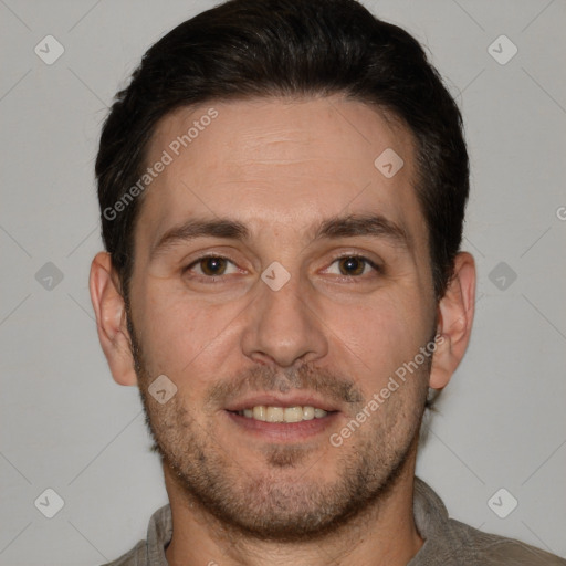 Joyful white adult male with short  brown hair and brown eyes