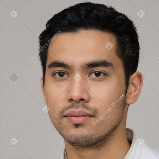 Neutral latino young-adult male with short  black hair and brown eyes