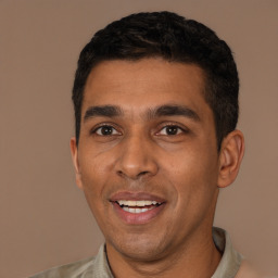 Joyful latino young-adult male with short  black hair and brown eyes