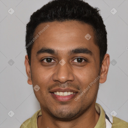 Joyful black young-adult male with short  black hair and brown eyes