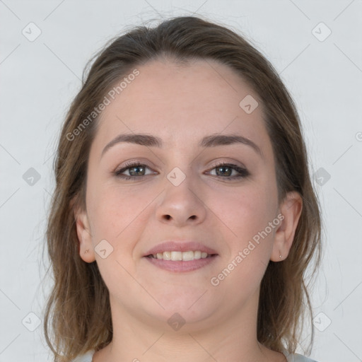 Joyful white young-adult female with medium  brown hair and grey eyes