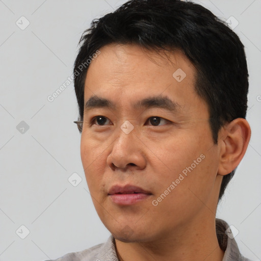 Neutral asian young-adult male with short  black hair and brown eyes