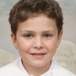 Joyful white child male with short  brown hair and brown eyes