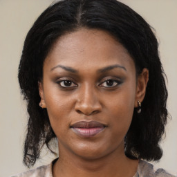 Joyful latino young-adult female with medium  black hair and brown eyes