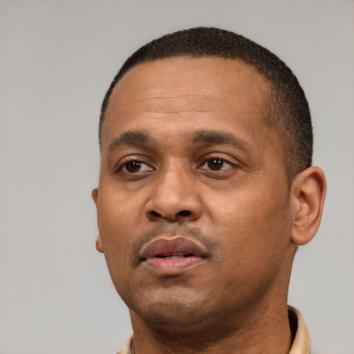 Neutral black adult male with short  black hair and brown eyes