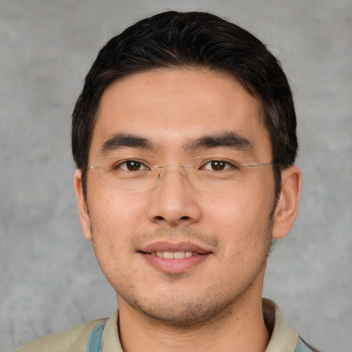 Joyful asian young-adult male with short  black hair and brown eyes