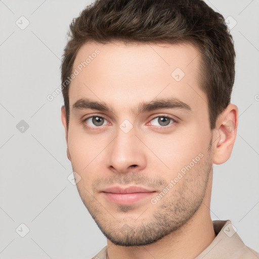 Neutral white young-adult male with short  brown hair and brown eyes