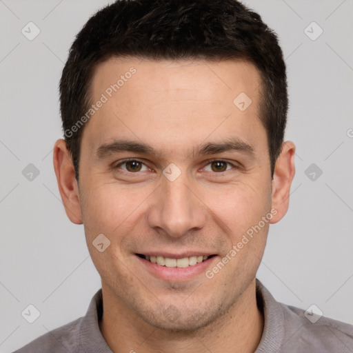 Joyful white young-adult male with short  brown hair and brown eyes