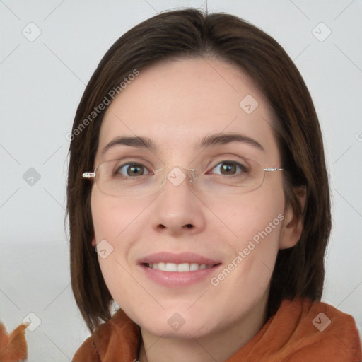 Joyful white young-adult female with medium  brown hair and green eyes