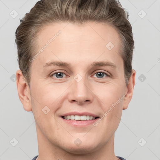 Joyful white adult male with short  brown hair and grey eyes