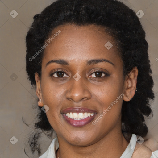 Joyful black young-adult female with medium  black hair and brown eyes