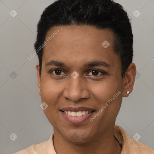 Joyful black young-adult male with short  brown hair and brown eyes