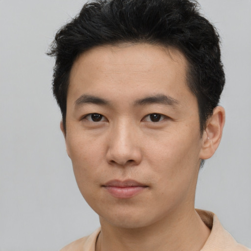 Neutral asian young-adult male with short  black hair and brown eyes