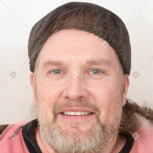 Joyful white adult male with short  brown hair and grey eyes