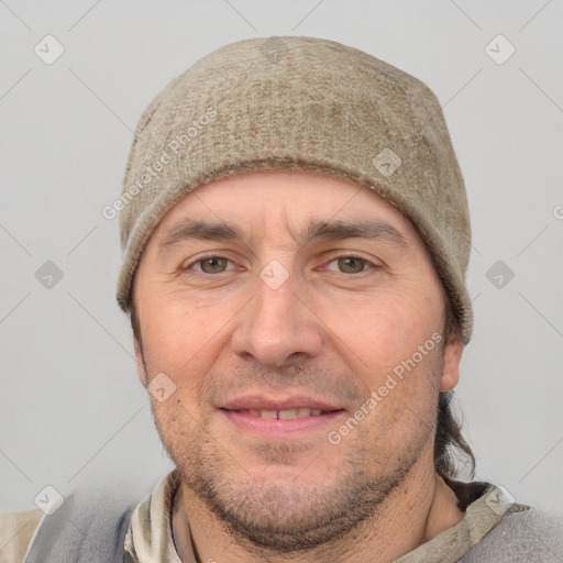 Joyful white adult male with short  brown hair and grey eyes