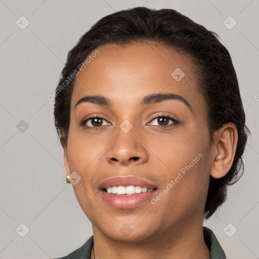 Joyful latino young-adult female with medium  brown hair and brown eyes