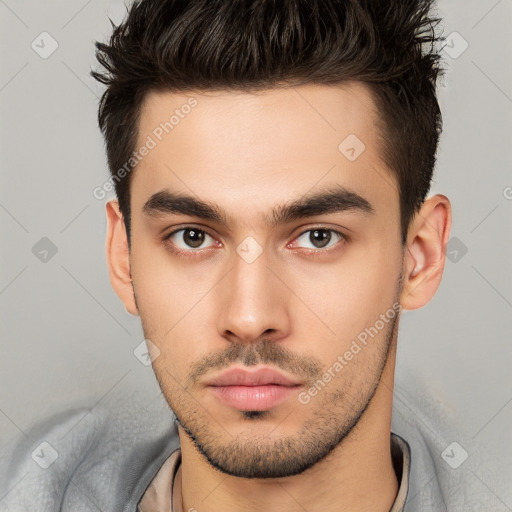 Neutral white young-adult male with short  brown hair and brown eyes