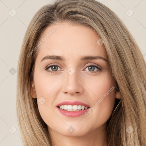 Joyful white young-adult female with long  brown hair and green eyes