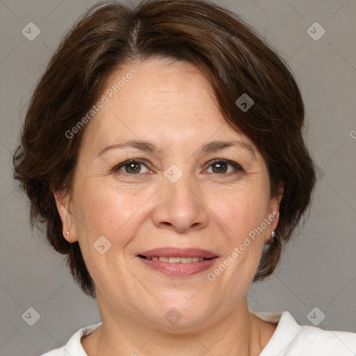 Joyful white adult female with medium  brown hair and brown eyes