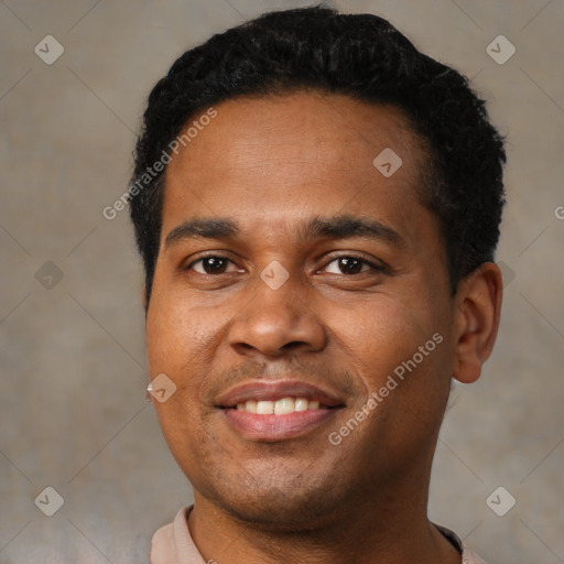 Joyful black young-adult male with short  black hair and brown eyes