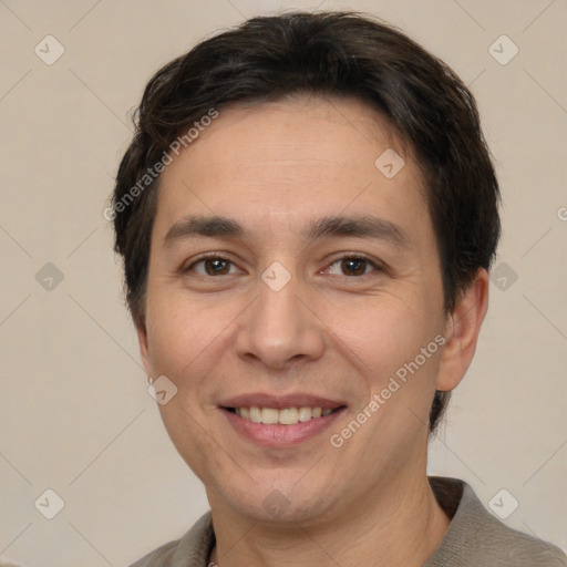 Joyful white adult male with short  brown hair and brown eyes