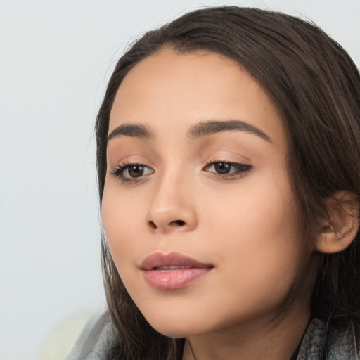 Joyful latino young-adult female with long  black hair and brown eyes