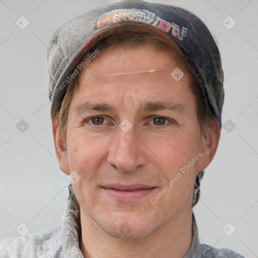 Joyful white adult male with short  brown hair and grey eyes