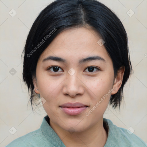Joyful asian young-adult female with medium  black hair and brown eyes