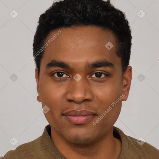 Joyful black young-adult male with short  black hair and brown eyes