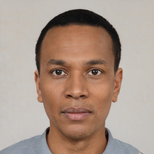 Neutral black young-adult male with short  black hair and brown eyes