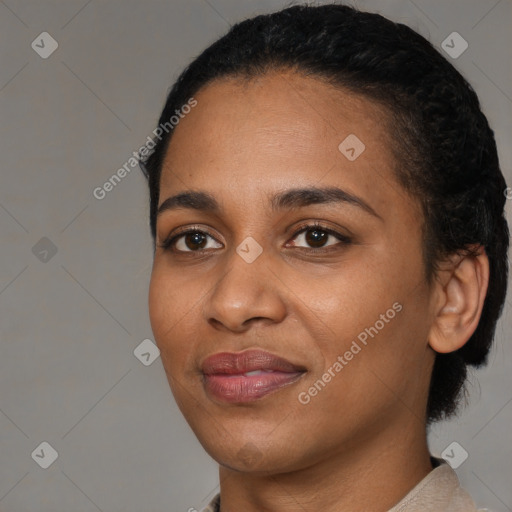 Joyful black young-adult female with short  black hair and brown eyes