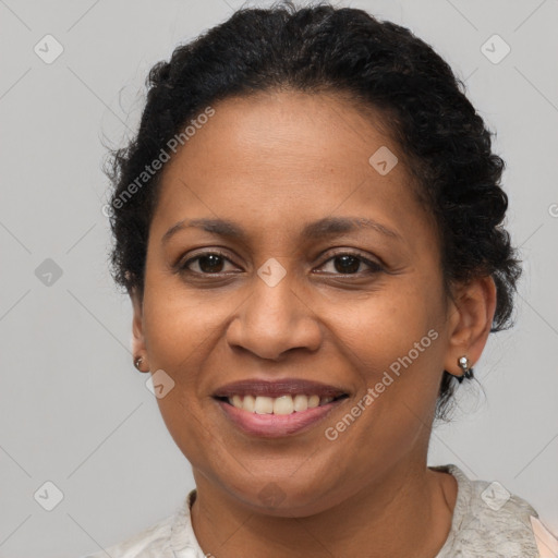 Joyful black adult female with short  brown hair and brown eyes